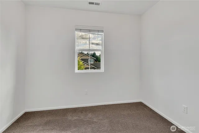 a view of a workspace with furniture and bathroom