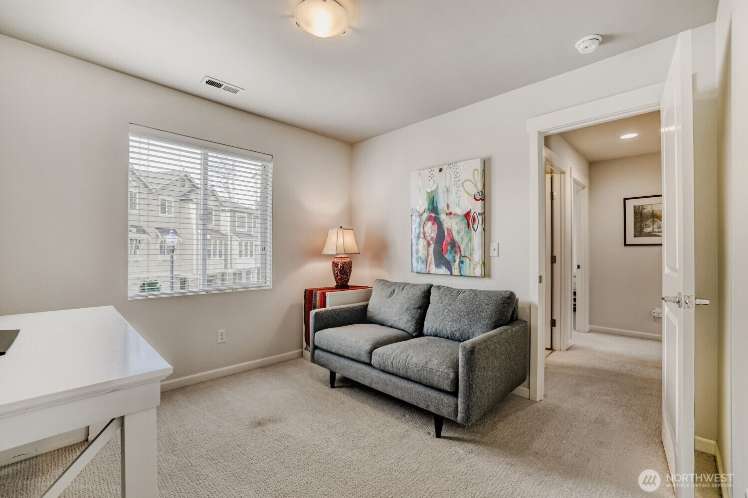 18705 101st Avenue Northeast, Unit 3 Bothell, WA 98011 - Photo 16 of 31 a living room with furniture and a window