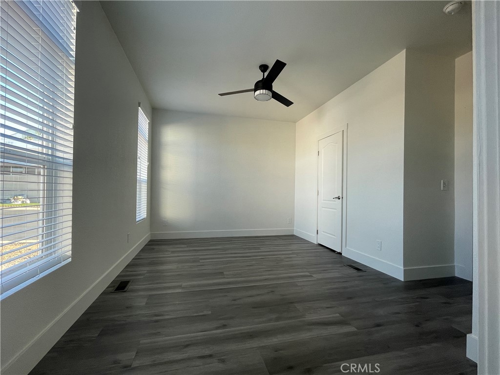 3500 Buchanan Street, Unit 138 Riverside, CA 92503 - Photo 11 of 18 a view of empty room with wooden floor and fan