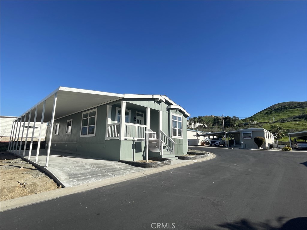3500 Buchanan Street, Unit 138 Riverside, CA 92503 - Photo 16 of 18 a front view of a house with a yard