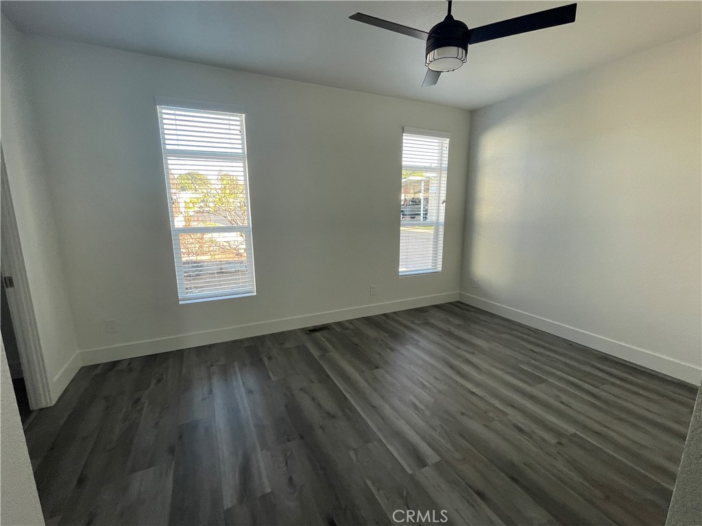 3500 Buchanan Street, Unit 138 Riverside, CA 92503 - Photo 8 of 18 wooden floor in an empty room with a window