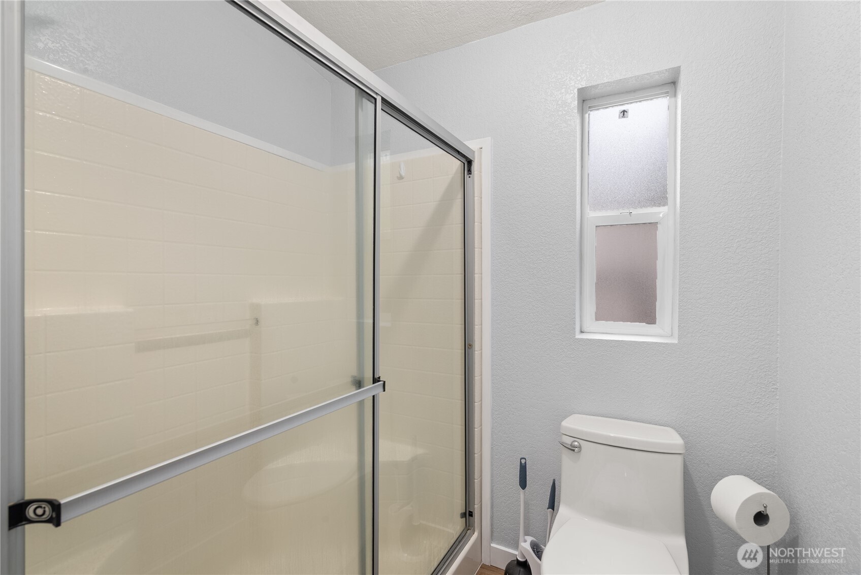 11727 Driver Street Southwest Olympia, WA 98512 - Photo 13 of 33 a bathroom with a toilet and a shower