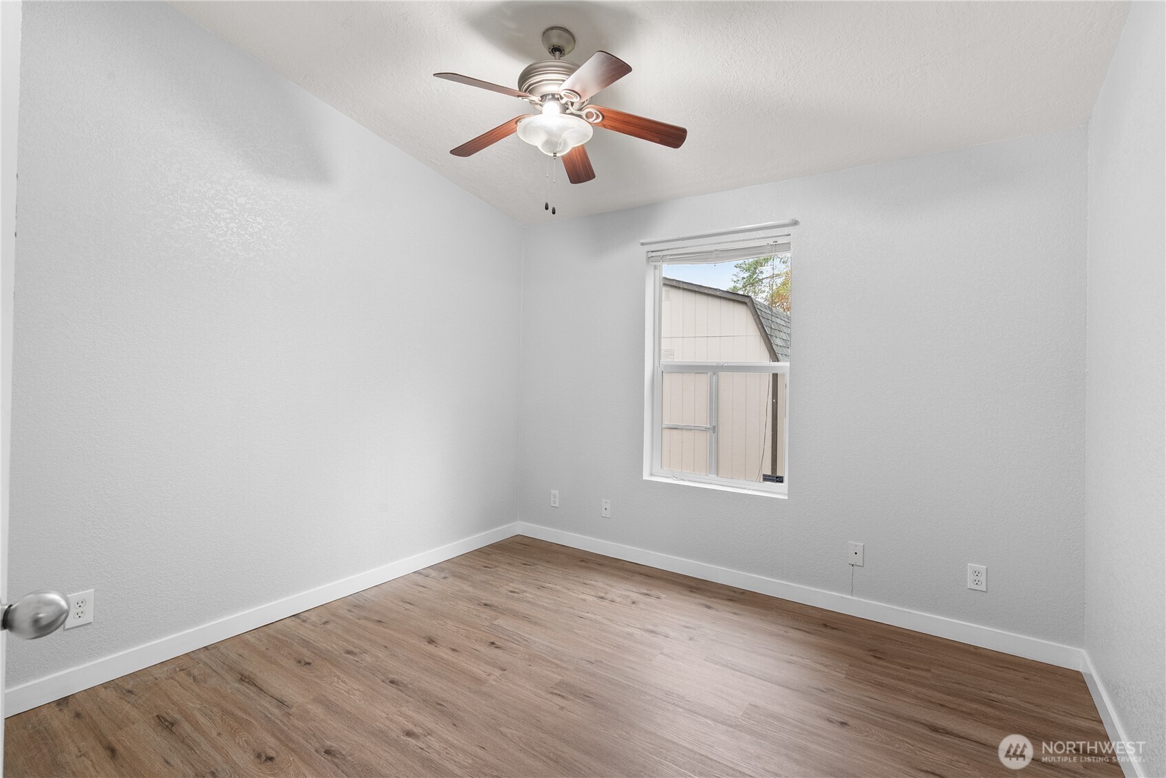 11727 Driver Street Southwest Olympia, WA 98512 - Photo 14 of 33 wooden floor in an empty room with a window