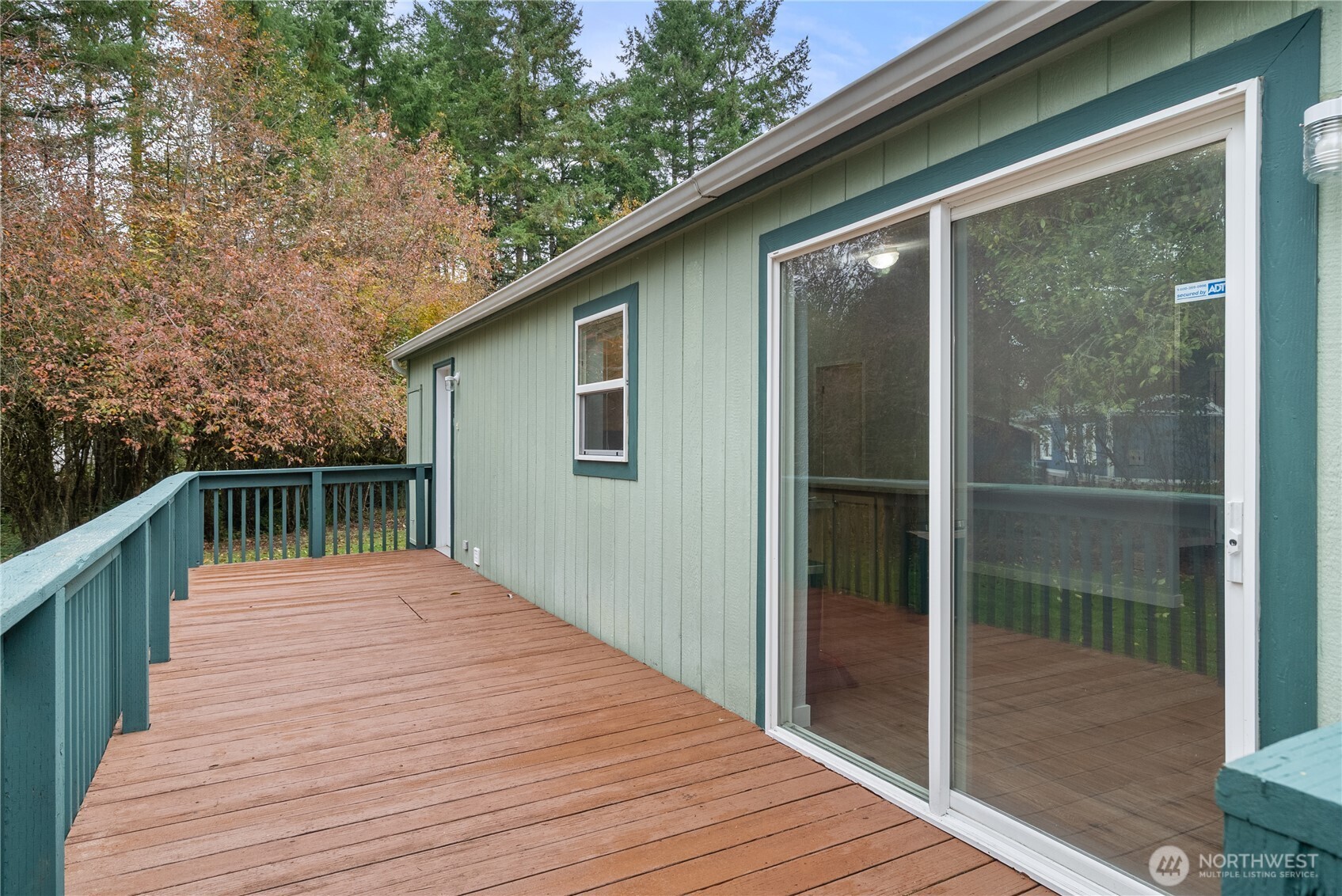 11727 Driver Street Southwest Olympia, WA 98512 - Photo 18 of 33 a balcony with wooden floor and yard in the back