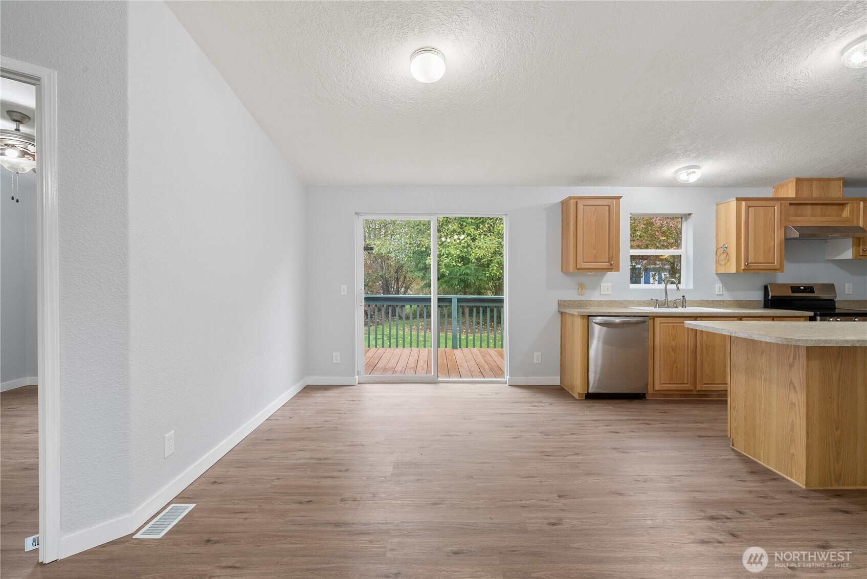 11727 Driver Street Southwest Olympia, WA 98512 - Photo 9 of 33 a kitchen with stainless steel appliances a refrigerator sink and cabinets