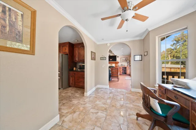 a view of a livingroom with furniture window and wooden floor