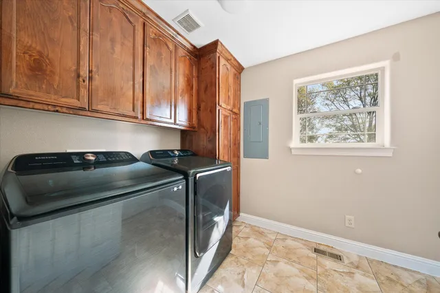 a kitchen with a refrigerator and a sink