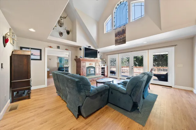 a living room with fireplace furniture and a flat screen tv