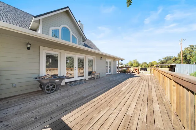 a view of a balcony with wooden floor