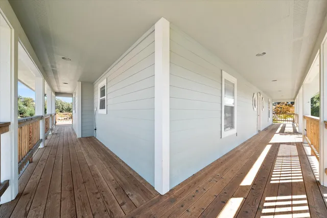 an aerial view of a house with a big yard
