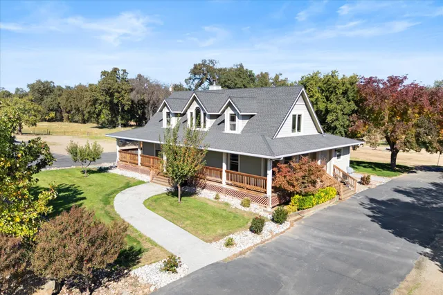an aerial view of a house with swimming pool