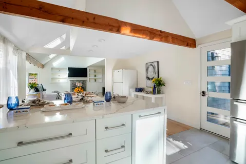 a view of a bathroom with a sink and mirror