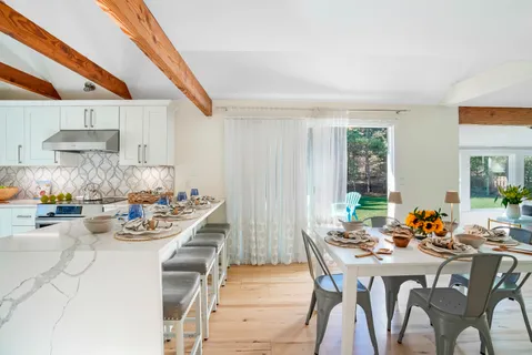 a view of a dining room with furniture window and outside view
