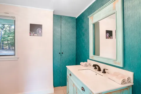 a bathroom with a sink and a mirror