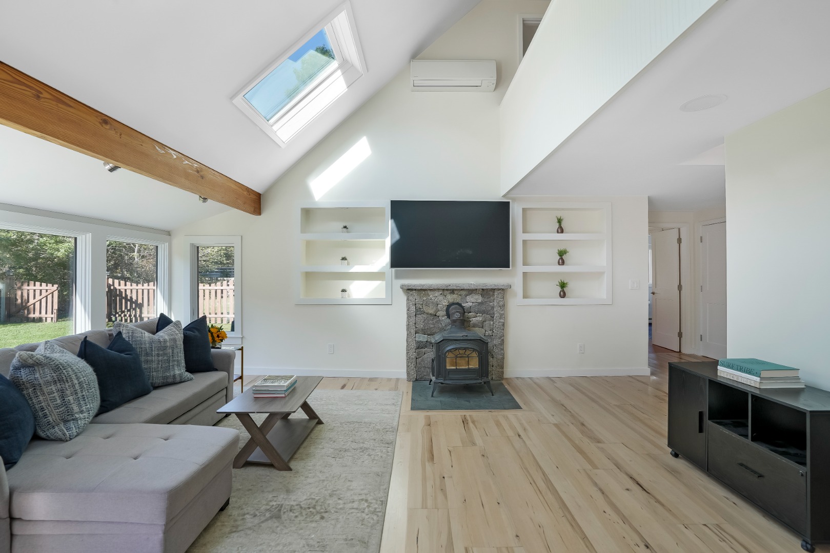 105 Stoney Hill Road West Tisbury, MA 02568 - Photo 25 of 44 a living room with furniture and a fireplace or television