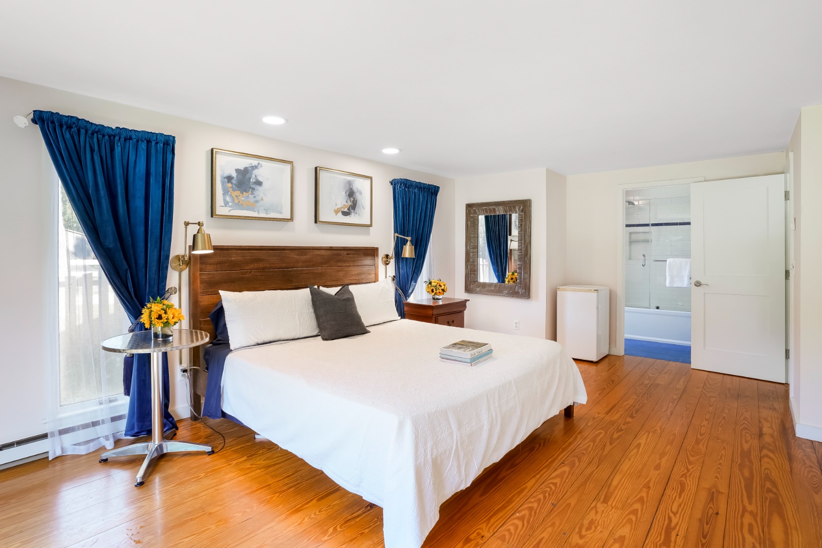 105 Stoney Hill Road West Tisbury, MA 02568 - Photo 26 of 44 a bedroom with a bed and wooden floor