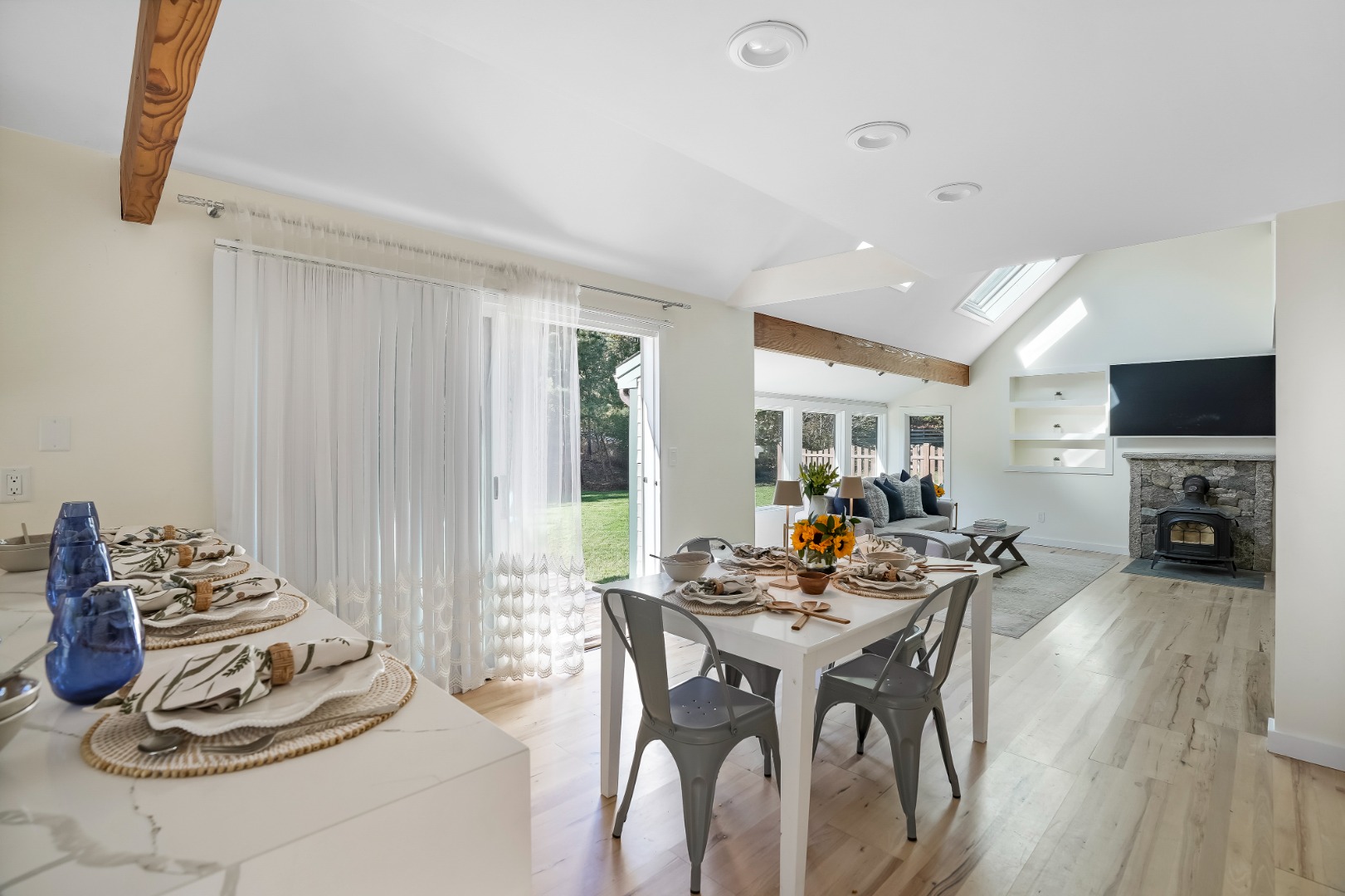105 Stoney Hill Road West Tisbury, MA 02568 - Photo 32 of 44 a view of a dining room with furniture window and wooden floor