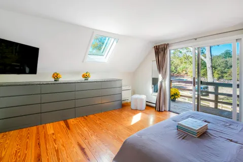 a living room with couch and a flat screen tv
