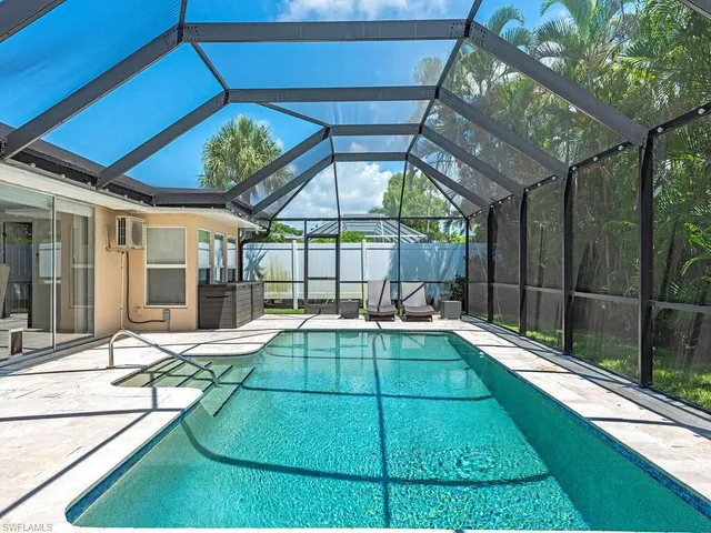 a view of a house with backyard and porch