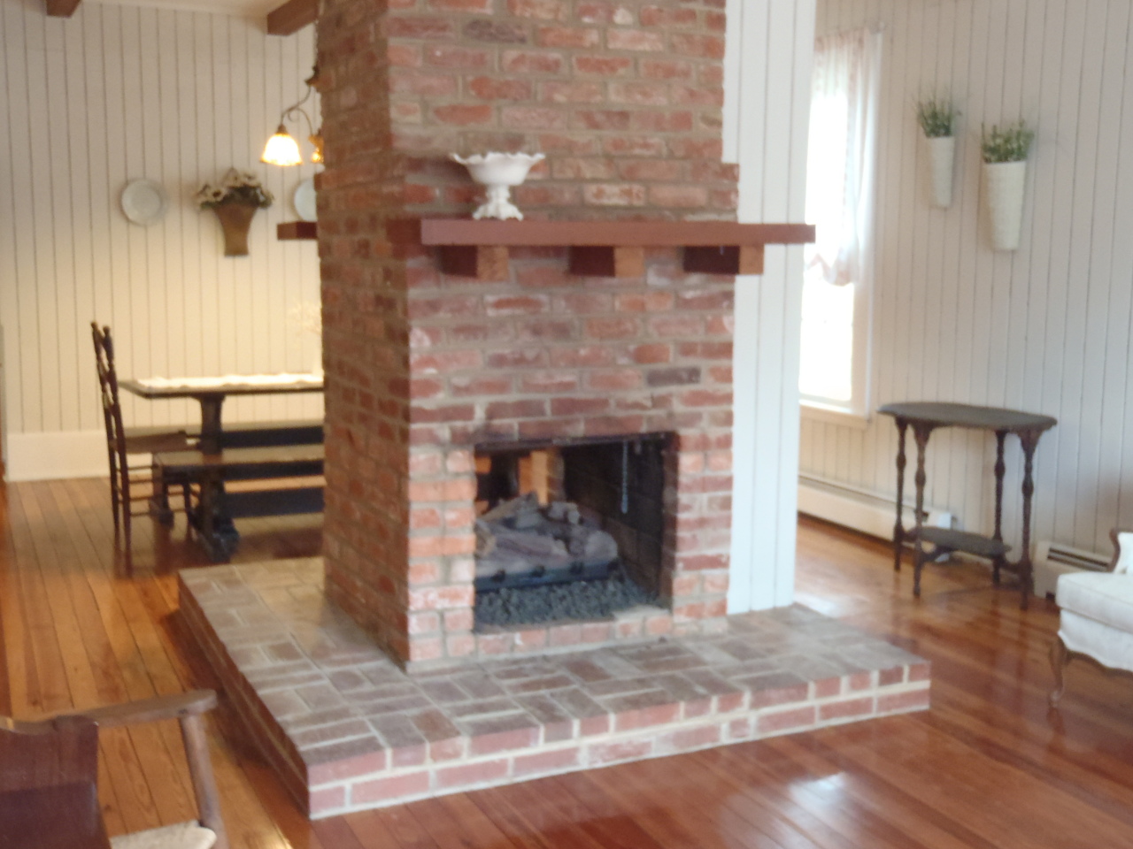 See through Masonry Fireplace with logs