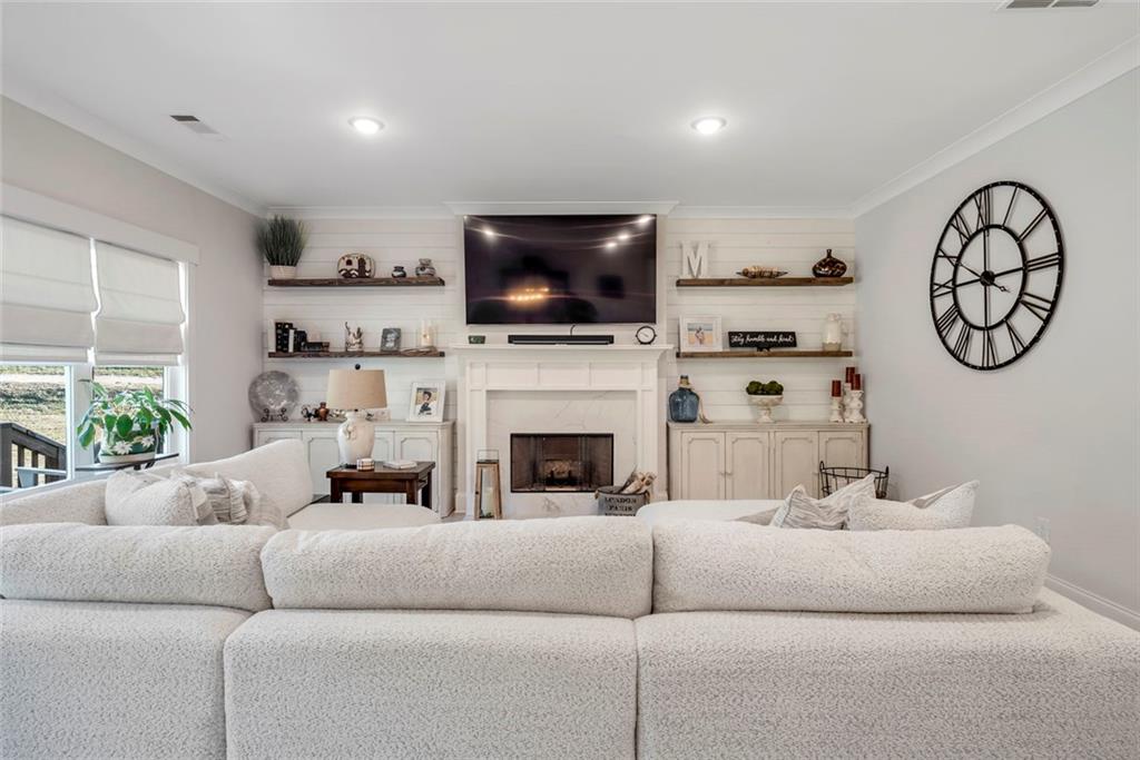 564 Old Airport Road Commerce, GA 30530 - Photo 12 of 39 a living room with furniture fireplace and flat screen tv