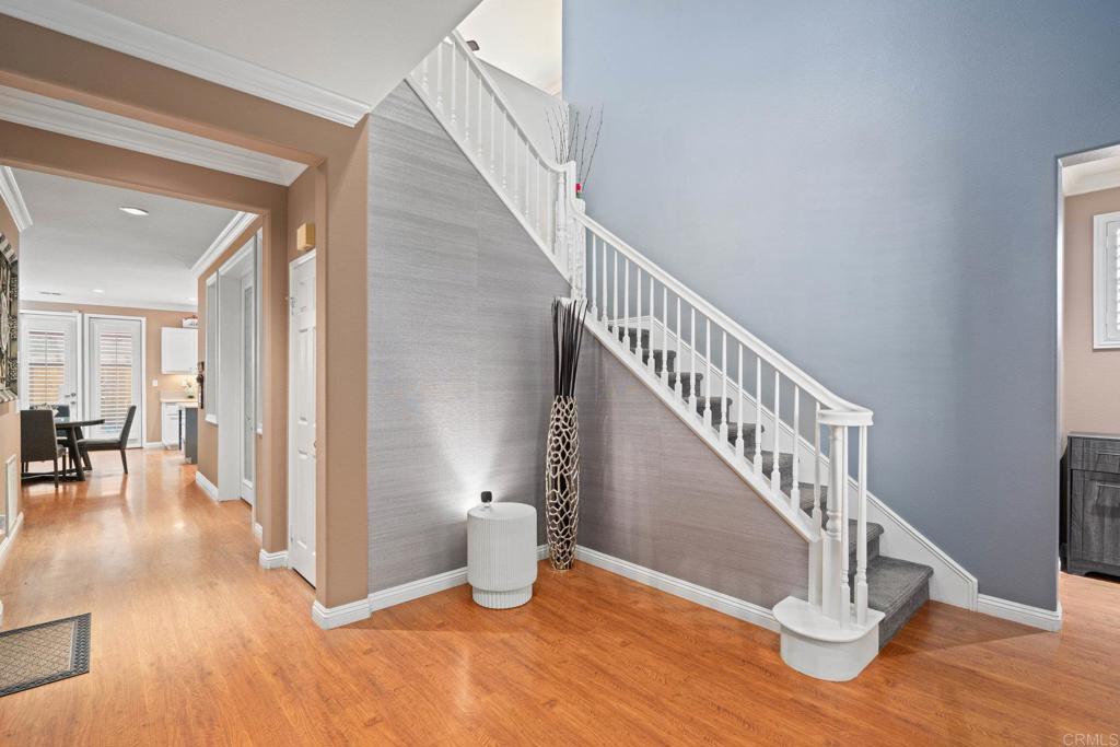5191 Cobalt Way Oceanside, CA 92057 - Photo 7 of 61 a view of entryway and hall with wooden floor