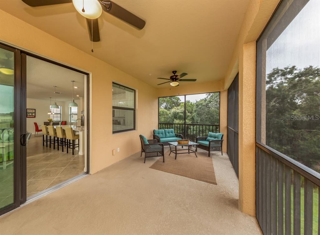 12550 Ghiberti Circle, Unit 201 Venice, FL 34293 - Photo 23 of 44 a view of a porch with seating space