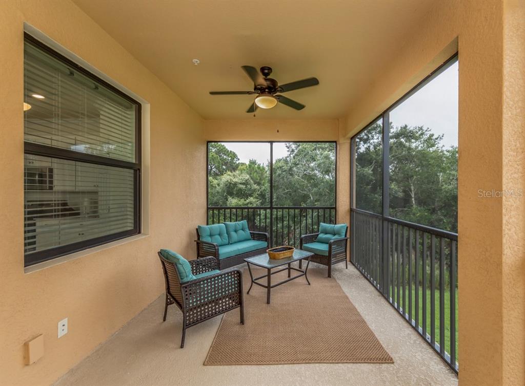 12550 Ghiberti Circle, Unit 201 Venice, FL 34293 - Photo 24 of 44 a living room with furniture and a large window