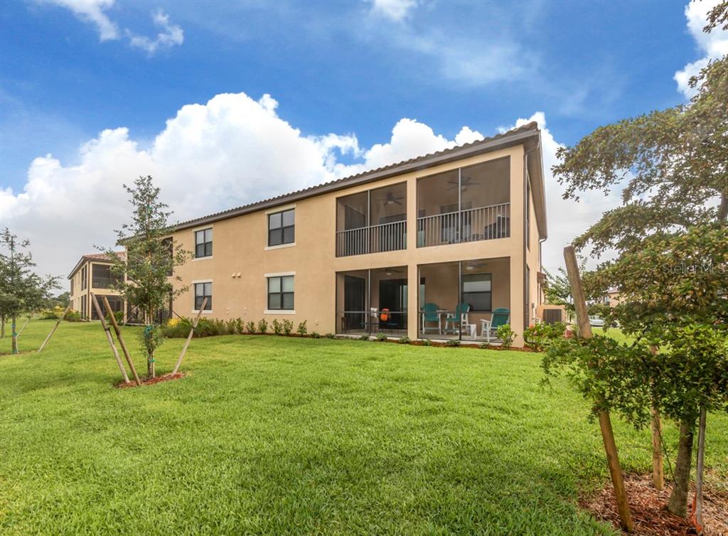 12550 Ghiberti Circle, Unit 201 Venice, FL 34293 - Photo 25 of 44 a view of a house with a backyard