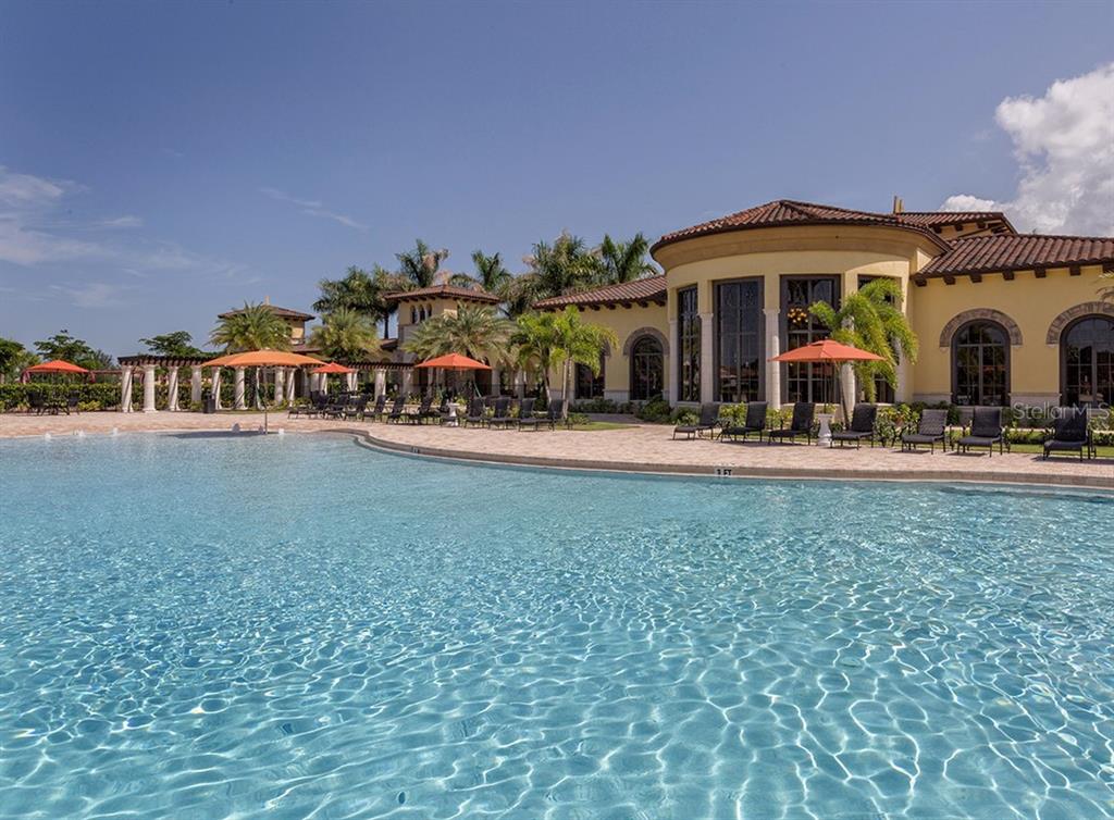 12550 Ghiberti Circle, Unit 201 Venice, FL 34293 - Photo 31 of 44 a view of a building and car parked
