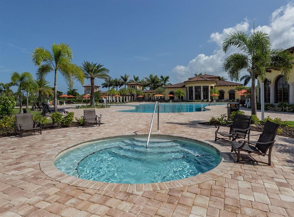 12550 Ghiberti Circle, Unit 201 Venice, FL 34293 - Photo 32 of 44 a view of a house with swimming pool and sitting area