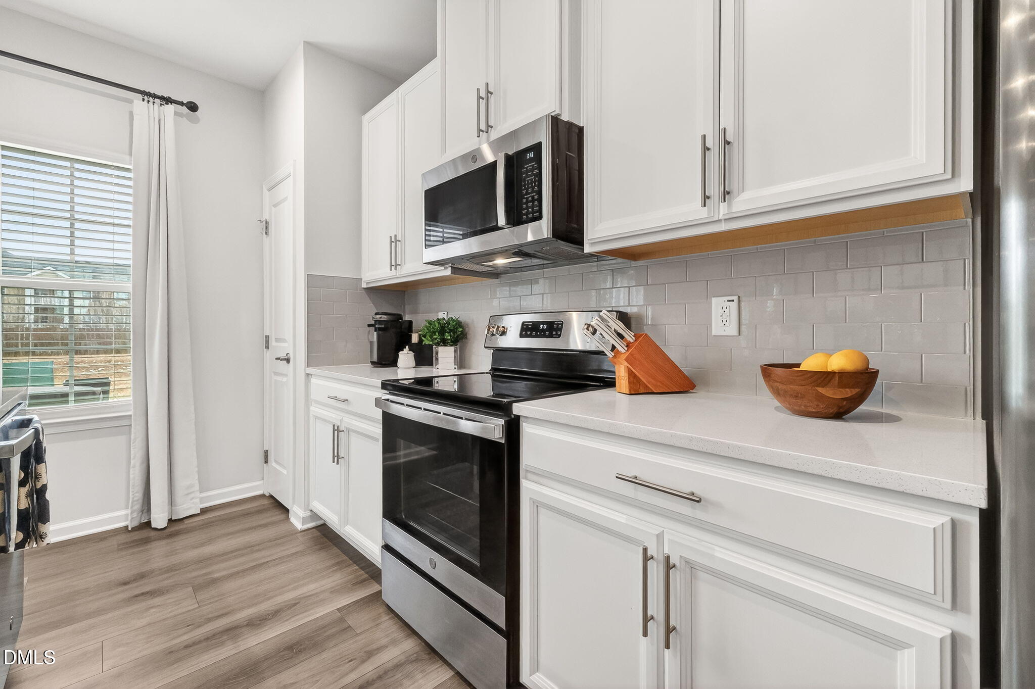 4922 Crossley Street Raleigh, NC 27616 - Photo 11 of 28 a kitchen with appliances a sink and cabinets