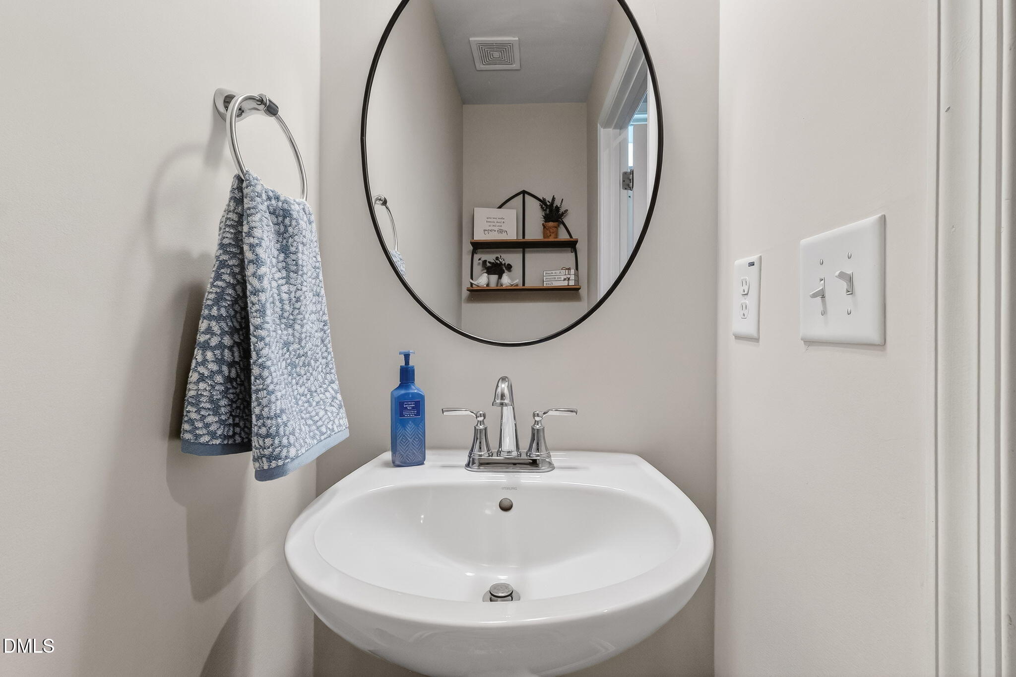 4922 Crossley Street Raleigh, NC 27616 - Photo 13 of 28 a bathroom with a mirror a sink and a mirror