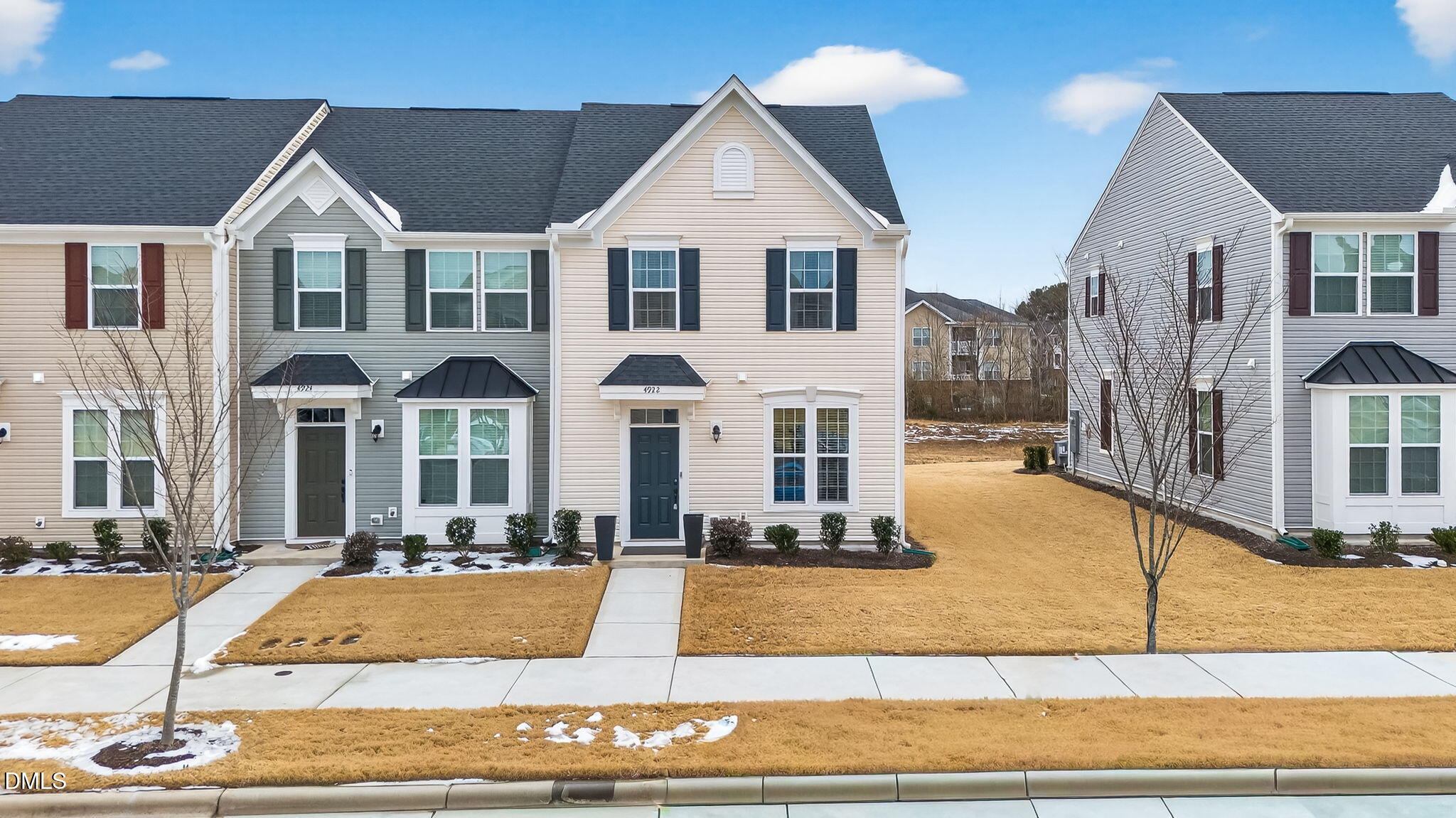 4922 Crossley Street Raleigh, NC 27616 - Photo 26 of 28 a view of a white house with large windows and plants