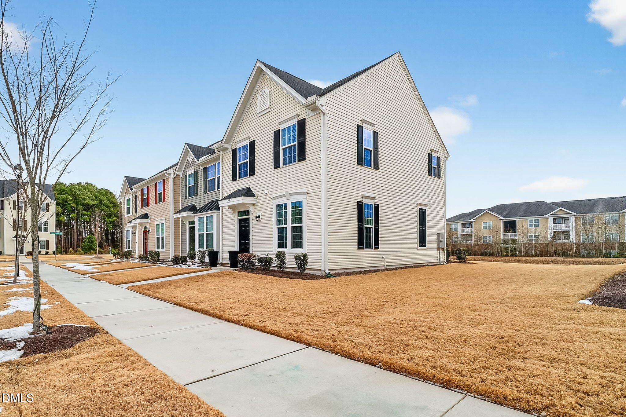 4922 Crossley Street Raleigh, NC 27616 - Photo 3 of 28 a view of a white house with a yard with big trees