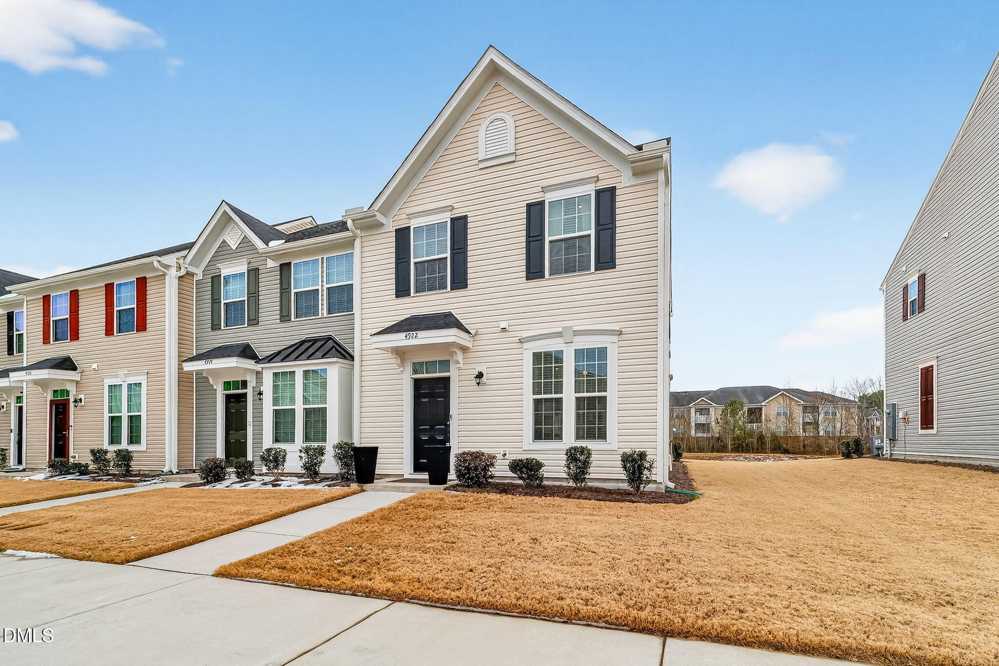 4922 Crossley Street Raleigh, NC 27616 - Photo 4 of 28 a front view of a house with a yard and garage