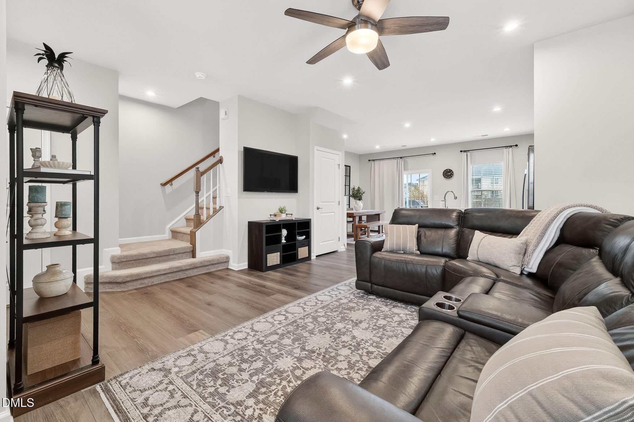 4922 Crossley Street Raleigh, NC 27616 - Photo 5 of 28 a living room with furniture a fireplace and a flat screen tv