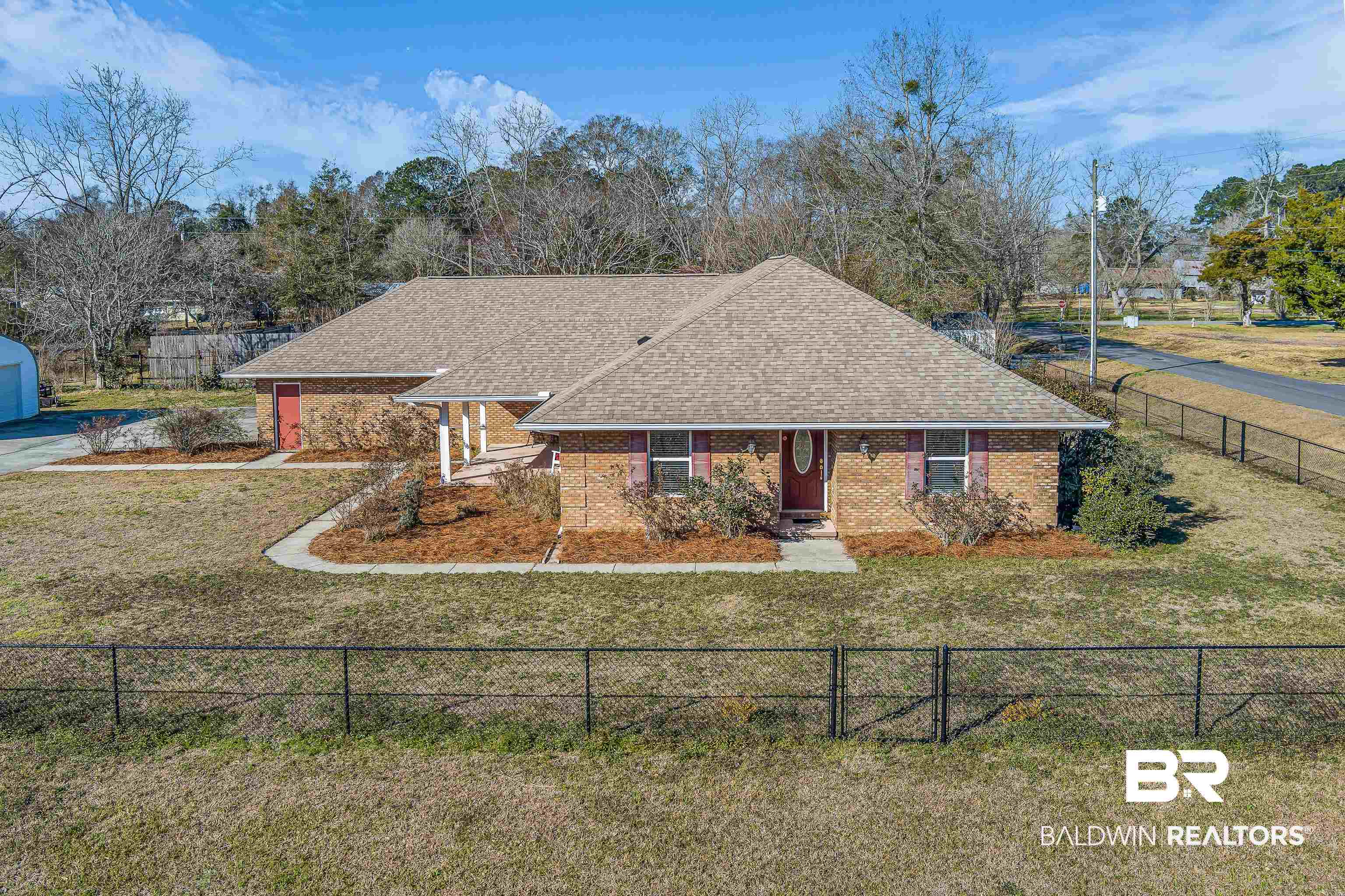 22095 8th Street Silverhill, AL 36576 - Photo 1 of 42 View of front of house with roof with shingles and brick siding