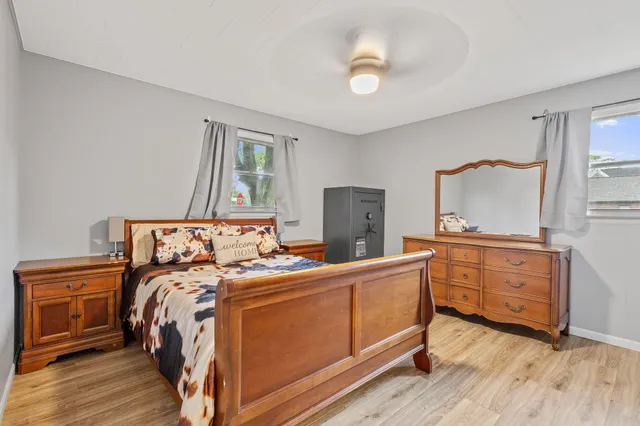 a bed room with a bed and a dresser