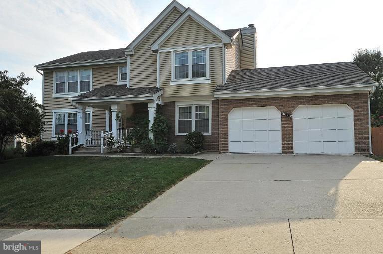 4107 Ulster Road Beltsville, MD 20705 - Photo 1 of 21 a front view of a house with a garden and yard