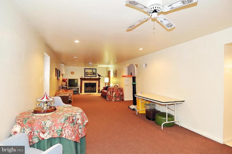 4107 Ulster Road Beltsville, MD 20705 - Photo 18 of 21 a bedroom with furniture and a chandelier