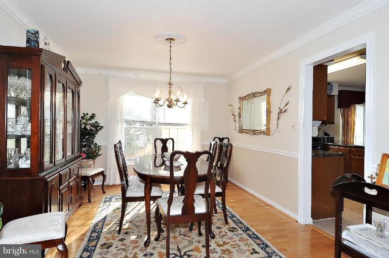 4107 Ulster Road Beltsville, MD 20705 - Photo 7 of 21 a view of a dining room with furniture window and wooden floor