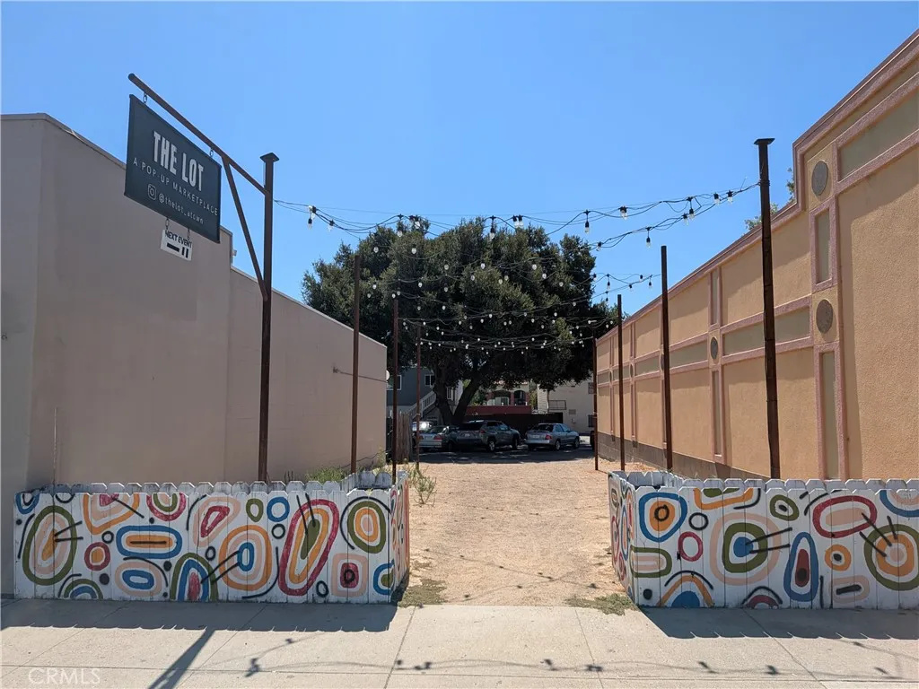 a view of street with wooden fence
