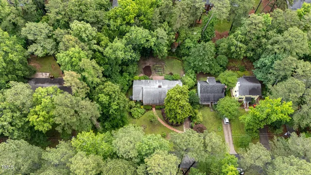 view of a house with a yard and sitting area