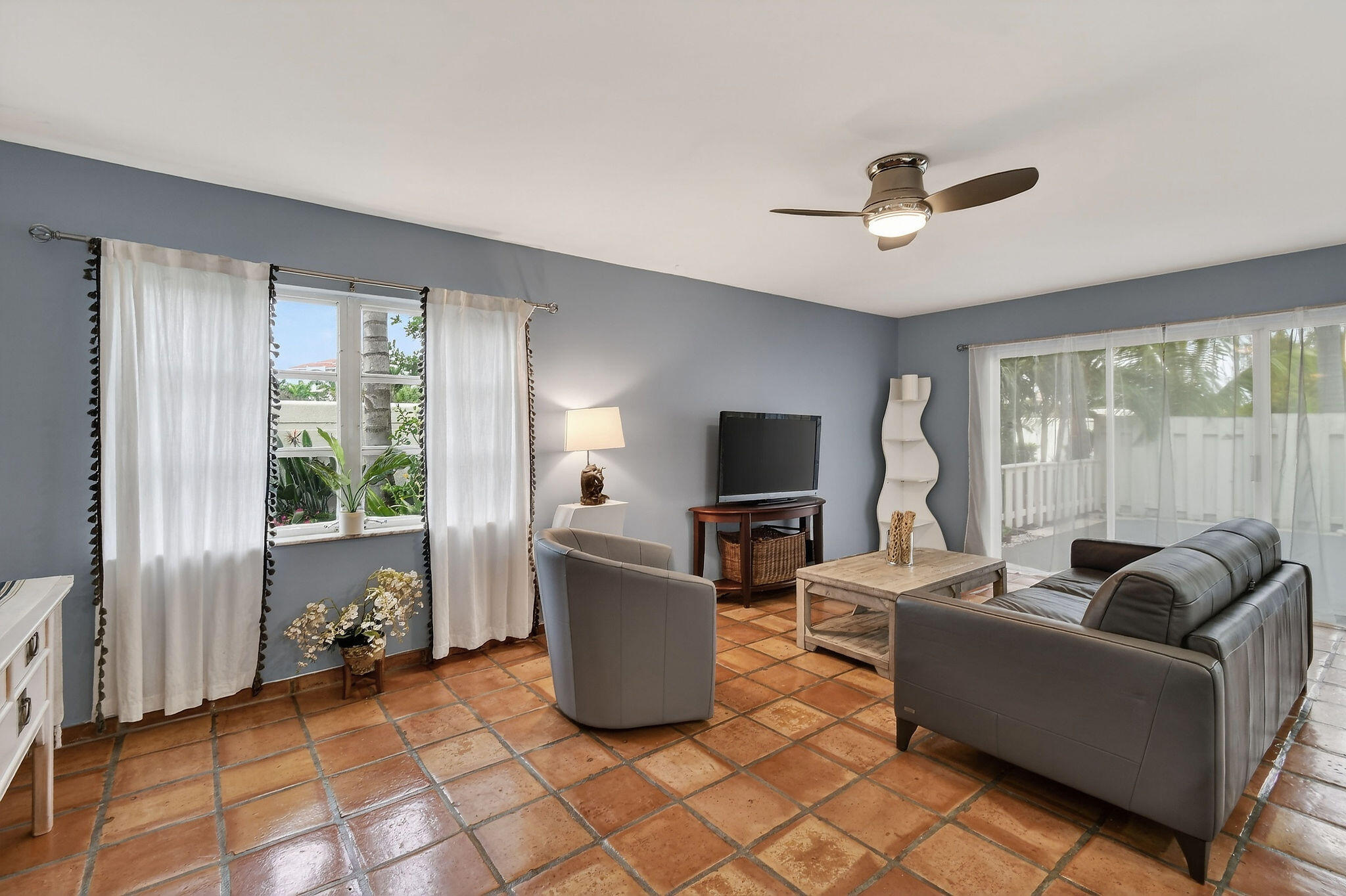170 Seabreeze Circle Jupiter, FL 33477 - Photo 23 of 72 a living room with furniture a window and a flat screen tv