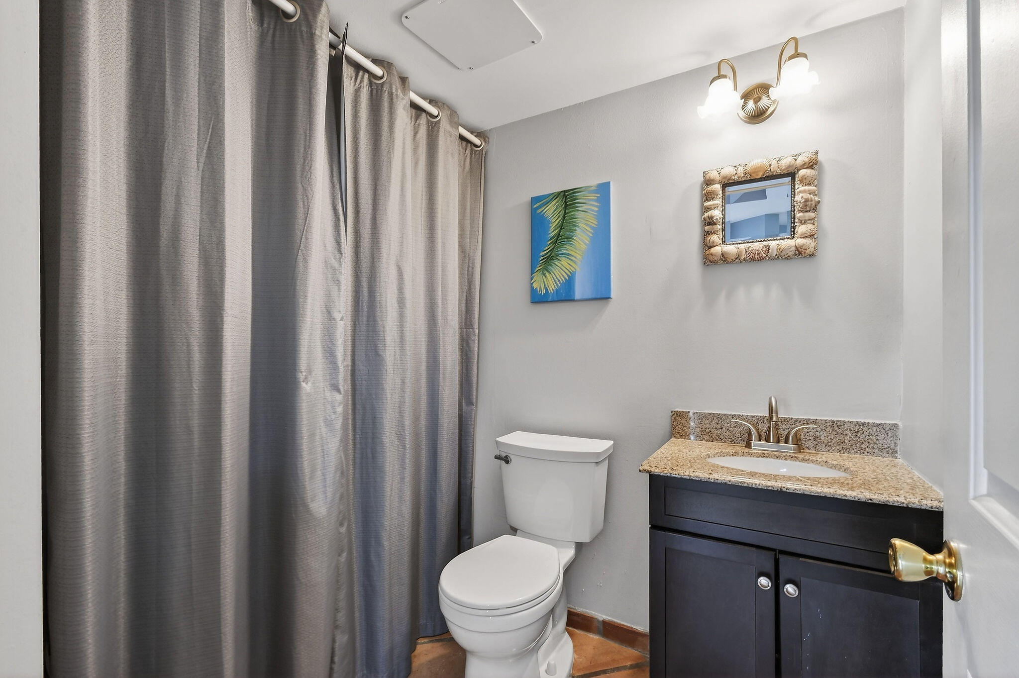 170 Seabreeze Circle Jupiter, FL 33477 - Photo 29 of 72 a bathroom with a sink a toilet and shower curtain