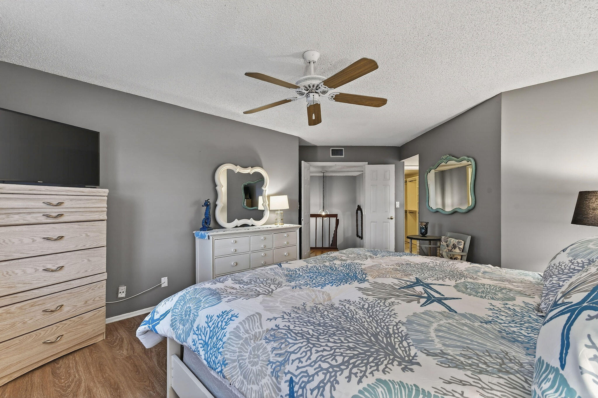 170 Seabreeze Circle Jupiter, FL 33477 - Photo 38 of 72 a bedroom with a bed and a flat screen tv
