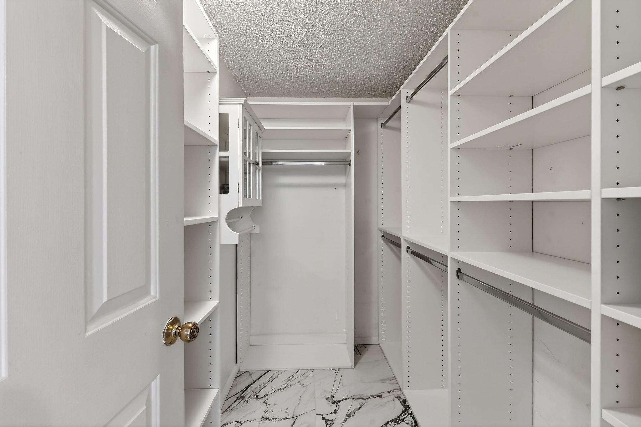 170 Seabreeze Circle Jupiter, FL 33477 - Photo 46 of 72 a view of walk in closet with empty racks