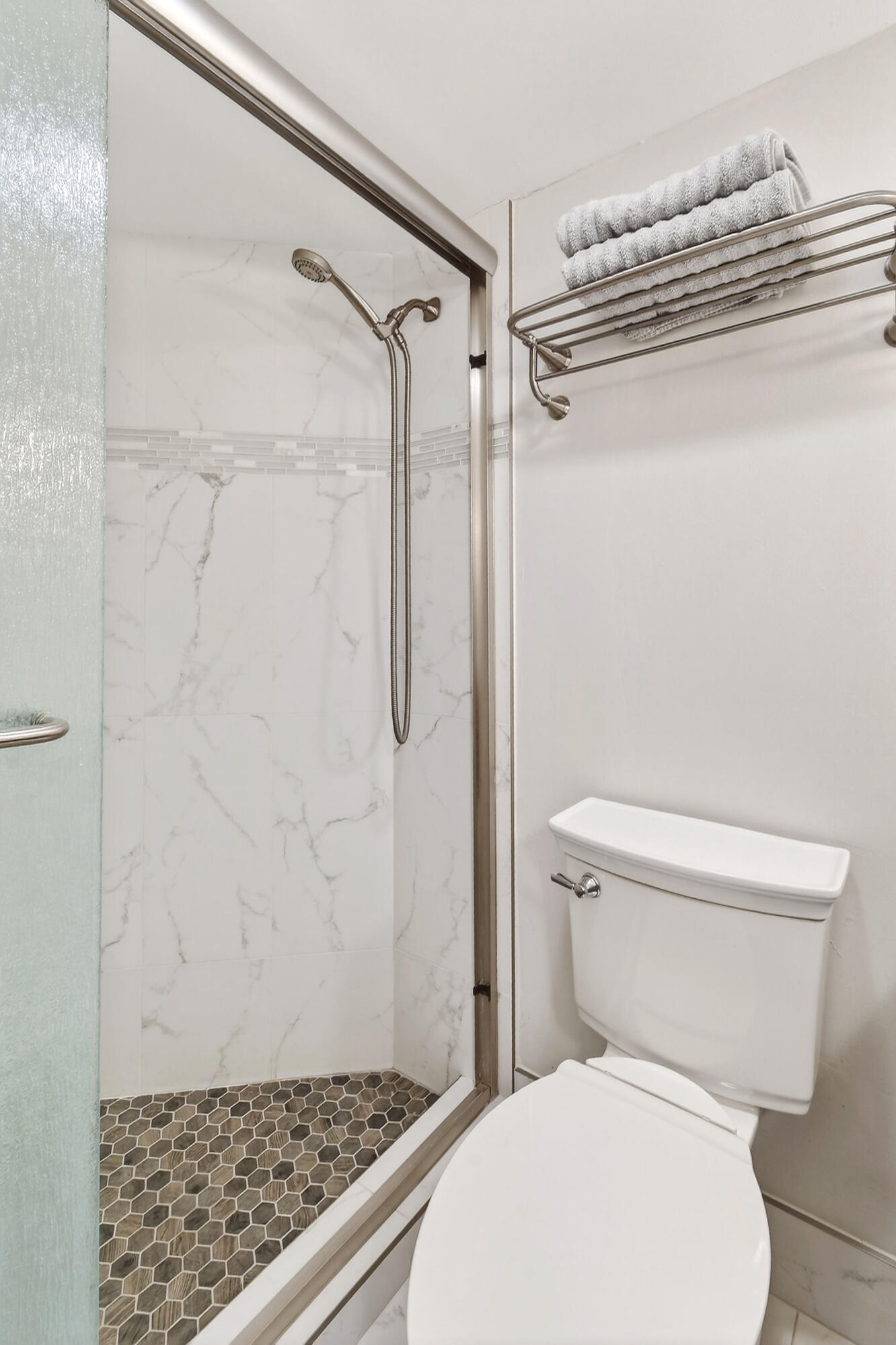 170 Seabreeze Circle Jupiter, FL 33477 - Photo 56 of 72 a white toilet sitting next to a shower