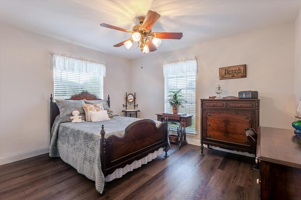 2400 Springfield Road Springtown, TX 76082 - Photo 19 of 31 Additional secondary bedroom with a built in desk perfect as a vanity or study space